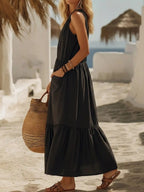 Plus size sleeveless maxi dress by Shopimist with zipper front, pocket details, and ruffle hem in a full-length style.