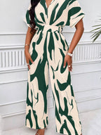 Abstract print wide-leg jumpsuit from Trendsi featuring a stylish, flowing design and comfortable fit.