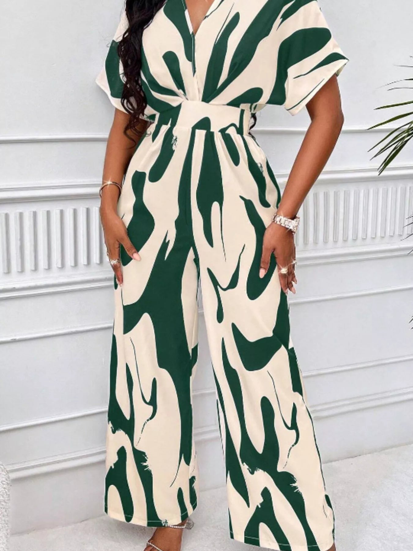 Abstract print wide-leg jumpsuit from Trendsi featuring a stylish, flowing design and comfortable fit.