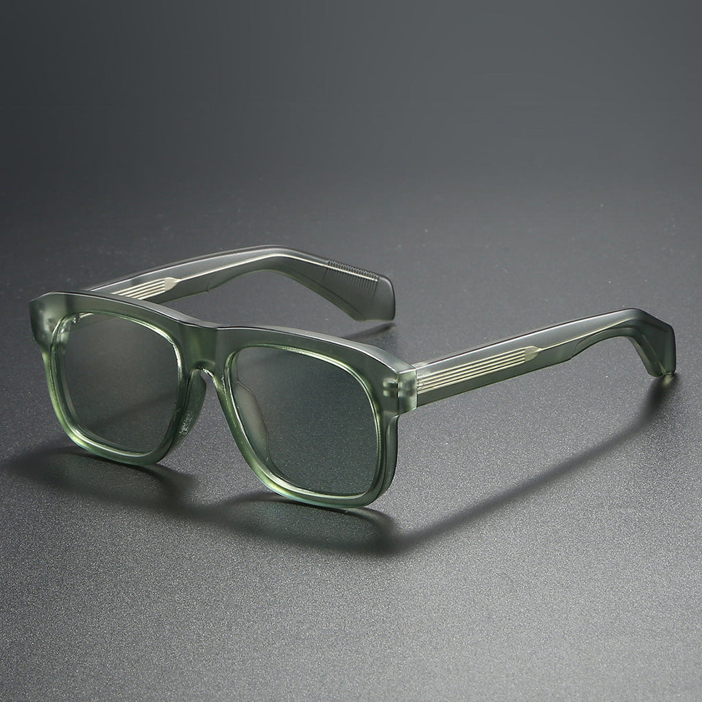 Unisex acetate-style polarized fashion sunglasses with a luxury look, featuring stylish frames and tinted lenses.