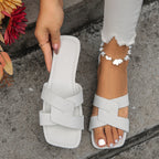 Plush Fashion Hub crisscross strap open toe flat sandals with stylish design, perfect for casual summer wear.
