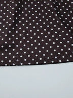 Polka dot cut-out front mini dress by Shopimist showing a stylish black and white spotted design with a cut-out detail at the front.
