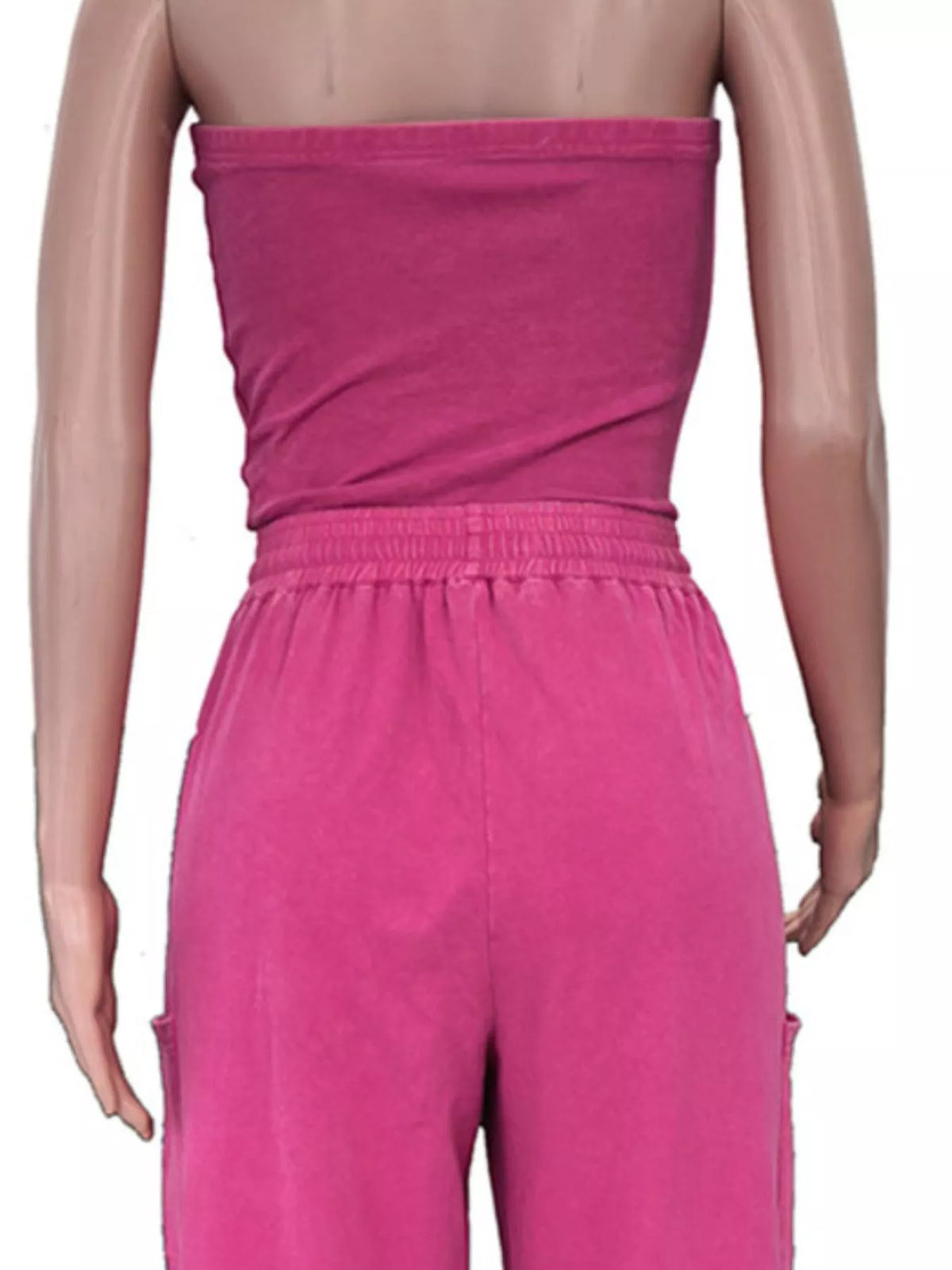 Strapless wide-leg jumpsuit with drawstring waist in soft fabric, from Plush Fashion Hub, shown on a mannequin.