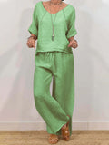 Women's multi-color two-piece casualwear set with V-neck top and matching pants from Plush Fashion Hub, featuring vibrant, comfortable fabric.
