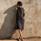 Women's sleeveless A-line midi dress in solid cotton linen, casual style by Plush Fashion Hub, shown in a natural pose.