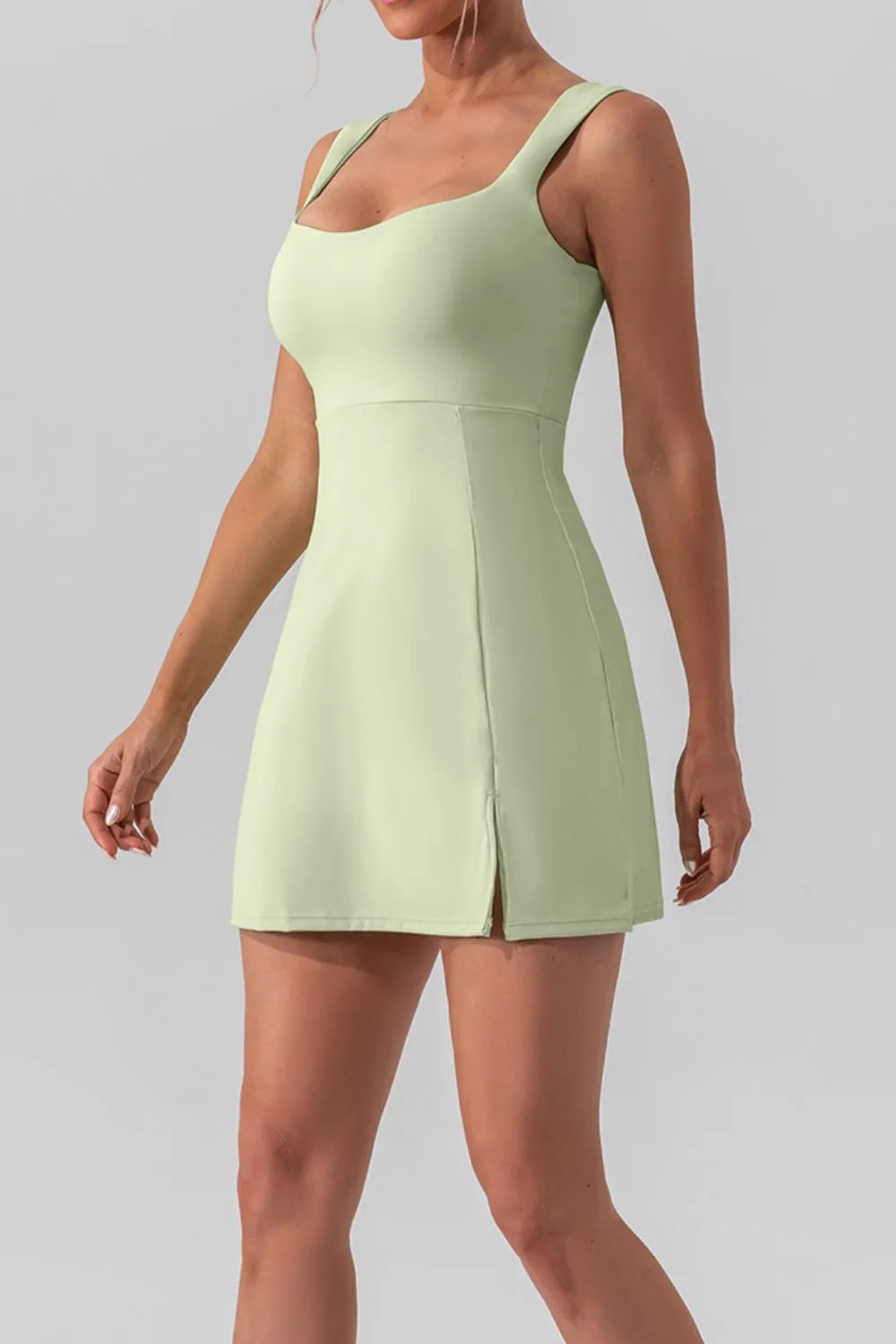 Square neck sleeveless slit mini active dress by Trendsi, featuring a fitted design ideal for workout or casual wear.