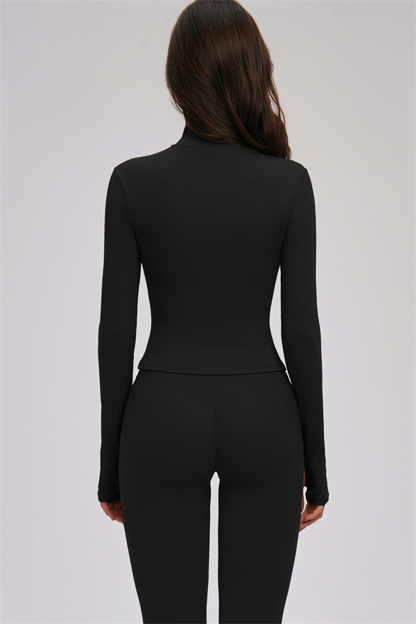 Fitglutes activewear Kinetic Zip Jacket, cross back sports bra, and leggings 3-piece workout set on a model.