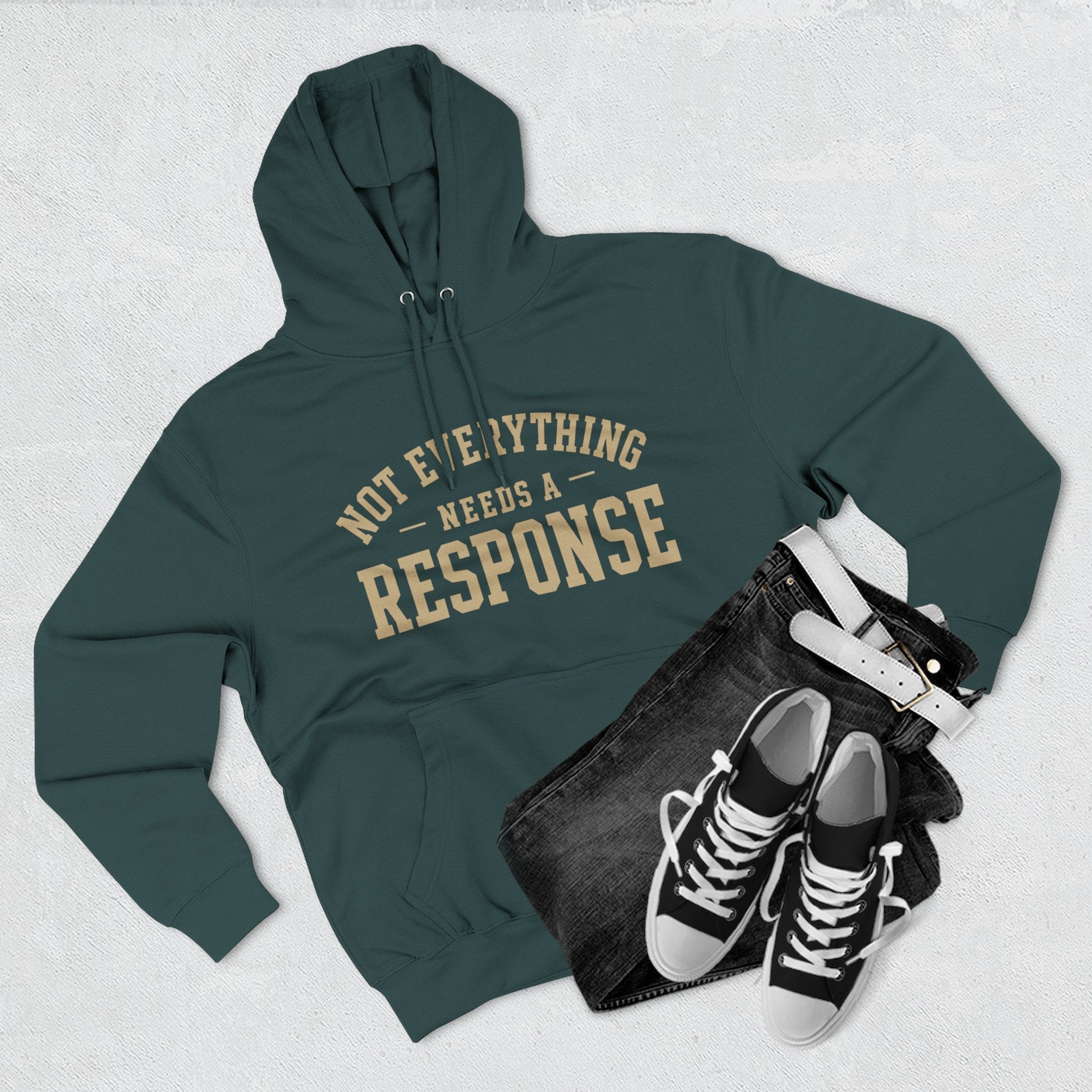 Black hoodie from Wear Your Worship's Not Everything Needs a Response collection, featuring a minimalist design and comfortable fit.