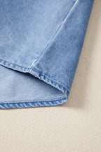 Women's distressed denim top with frilled collar and flutter sleeves, stylish casual blouse from Trendsi.
