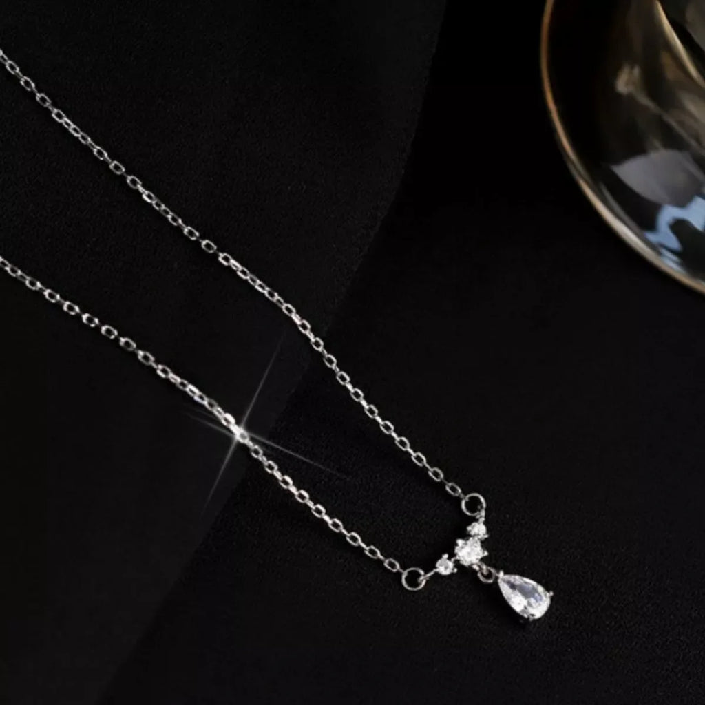 Sterling silver zircon teardrop necklace with elegant design, featuring a sparkling teardrop pendant on a delicate chain.
