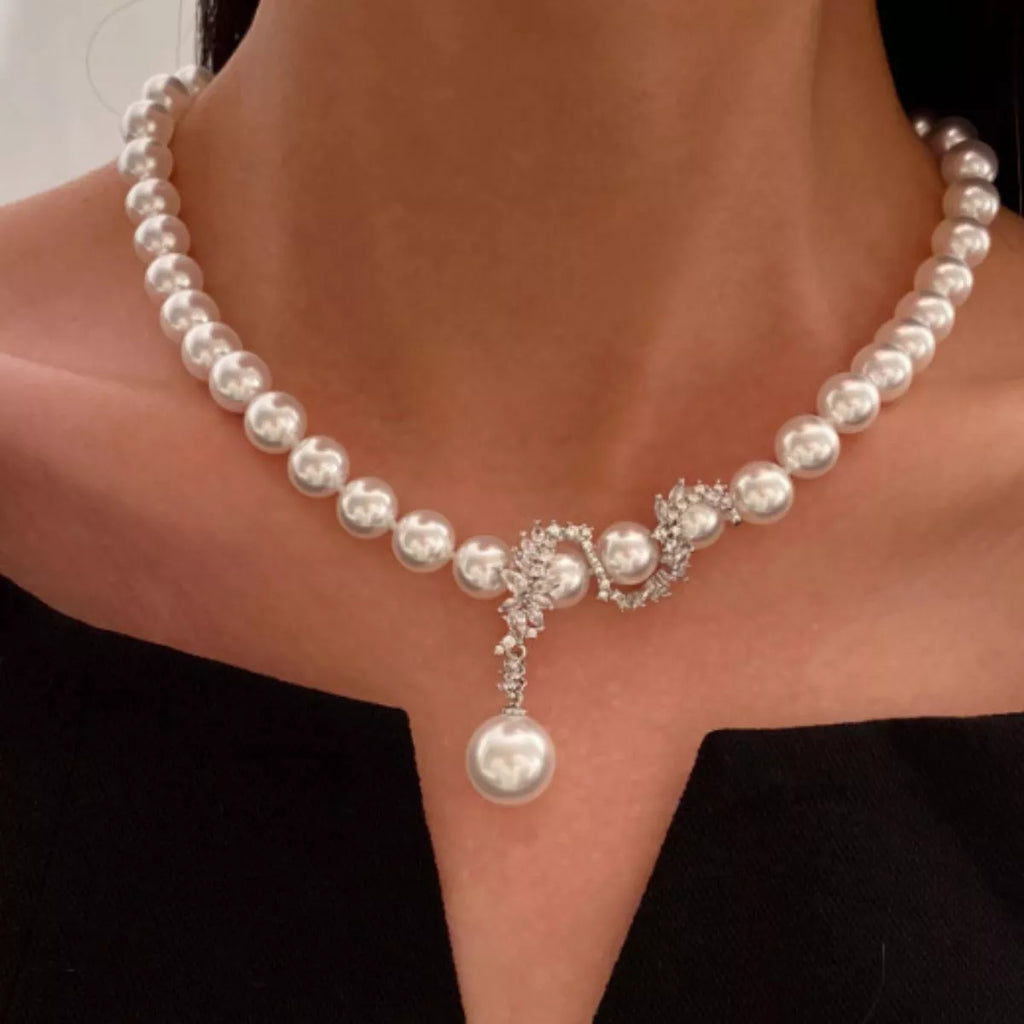 Zircon pearl necklace by Shopimist featuring a string of sparkling zircon and pearl beads on a delicate chain.