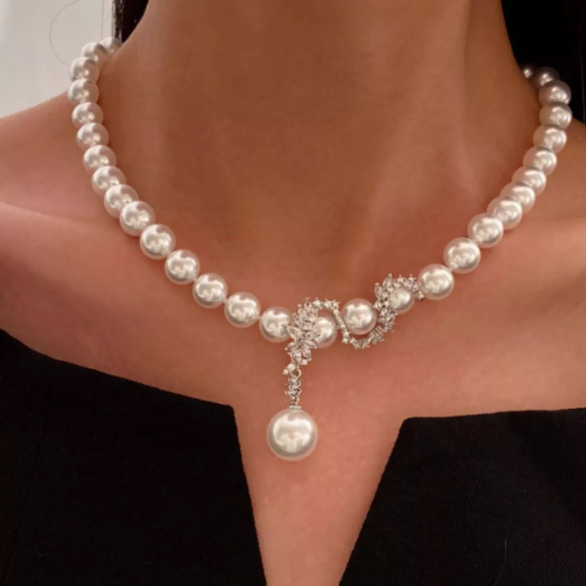 Zircon pearl necklace by Shopimist featuring a string of sparkling zircon and pearl beads on a delicate chain.