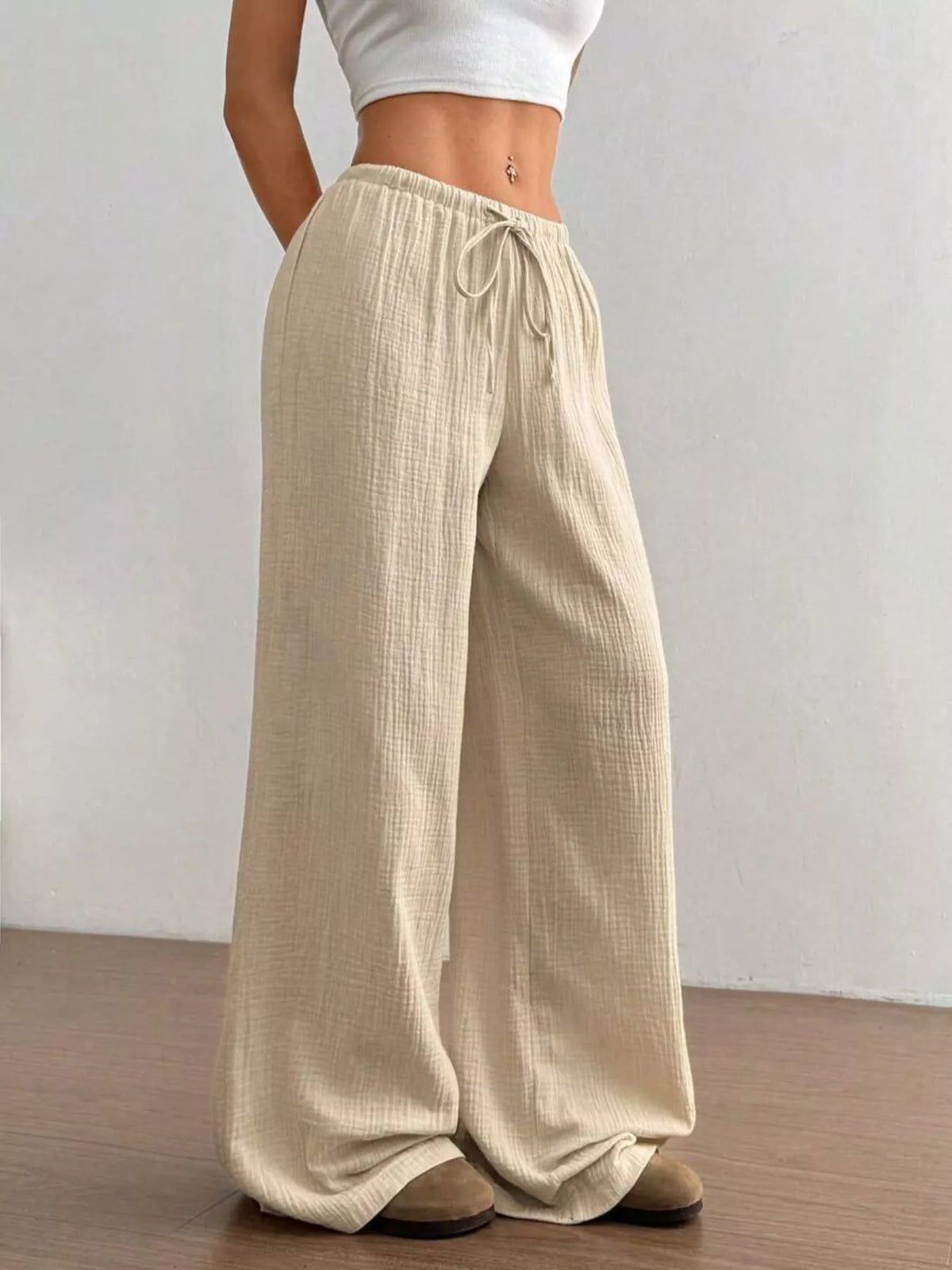 Soft plush pink wide-leg drawstring pants by Plush Fashion Hub, with relaxed fit and comfortable waistband.