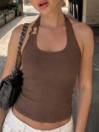 Ribbed halter neck tank top by Shopimist, featuring a close-up of the fitted design and textured fabric in a neutral color.