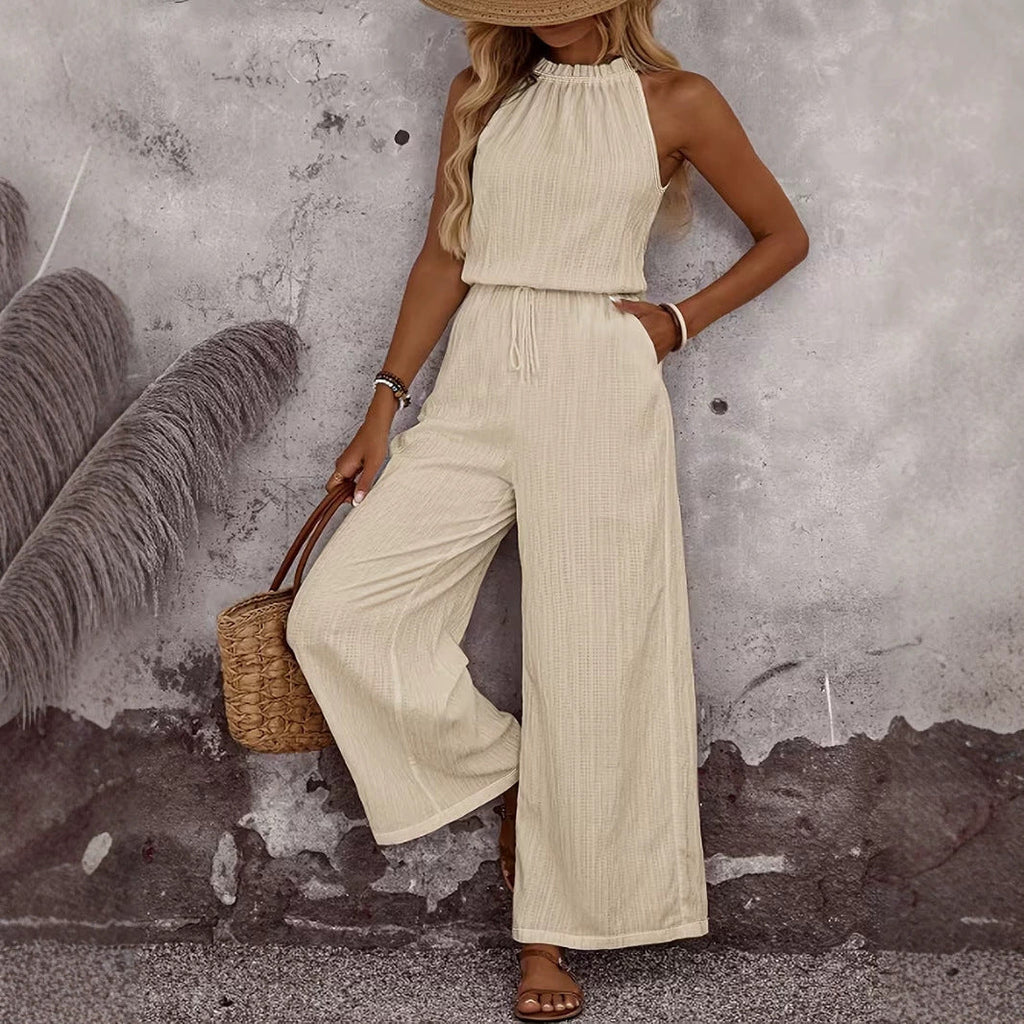 Women's sleeveless draped neck vest and casual pants two-piece set by Plush Fashion Hub, shown in a relaxed casualwear style.