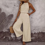 Women's sleeveless draped neck vest and casual pants two-piece set by Plush Fashion Hub, shown in a relaxed casualwear style.