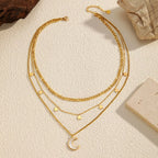 18K gold-plated moon three-layered necklace with delicate chain and layered design, showcasing a celestial-inspired jewelry piece
