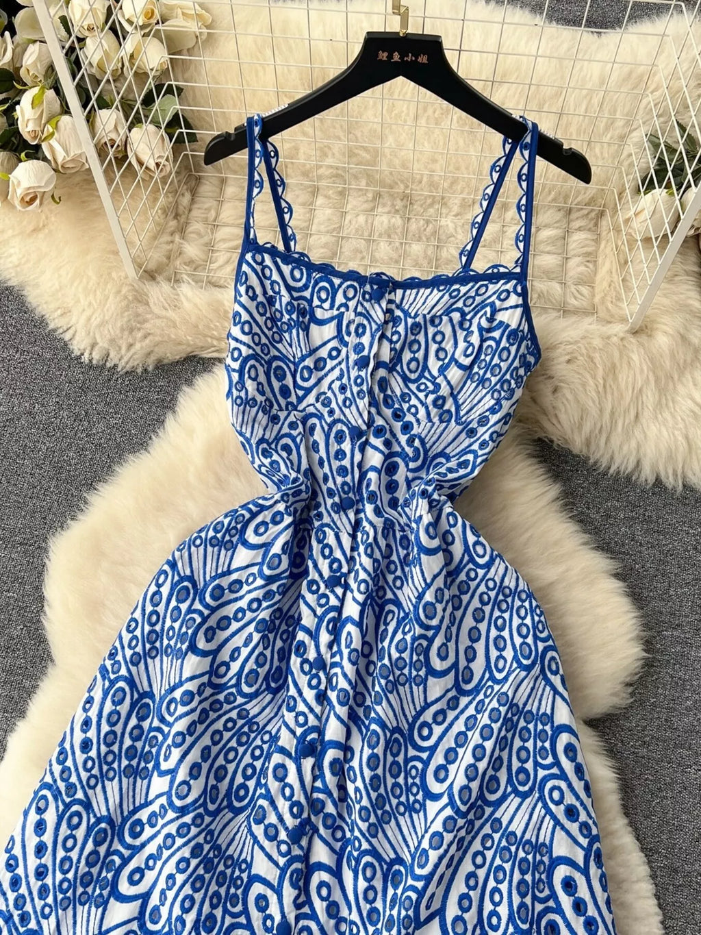 Eyelet embroidered tiered camisole dress, summer boho midi dress with eyelet details and layered design, by Trendsi.