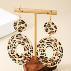 Leopard print dangle earrings by Shopimist featuring gold hooks and bold animal print design for stylish accessories.