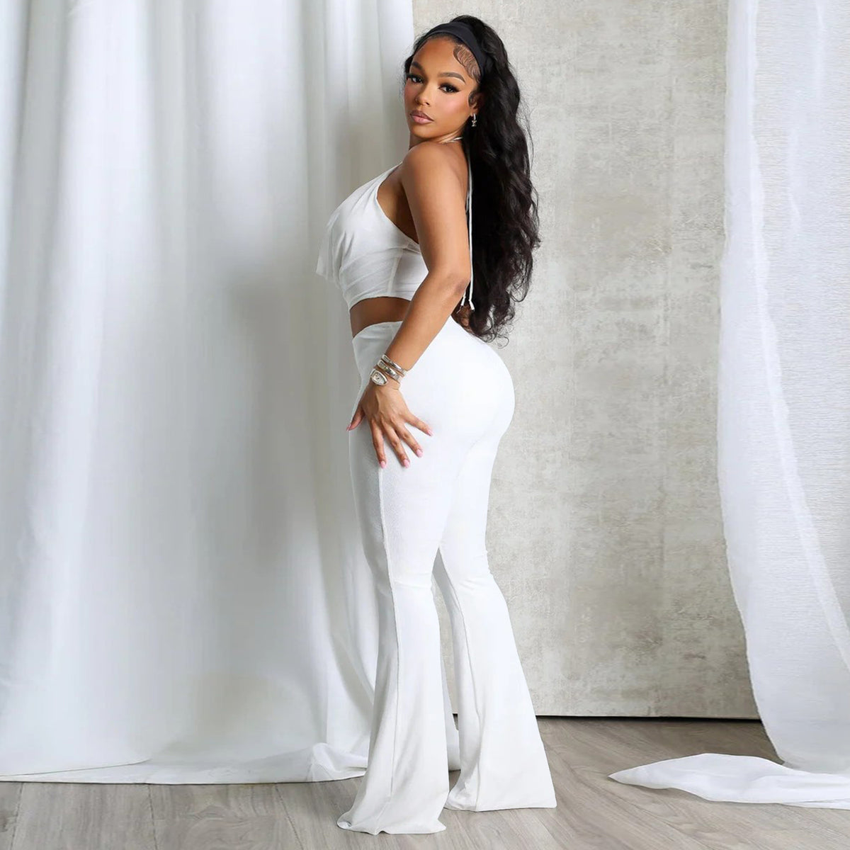Plush Fashion Hub sleek halter neck cut-out waist jumpsuit featuring fitted design and stylish silhouette.