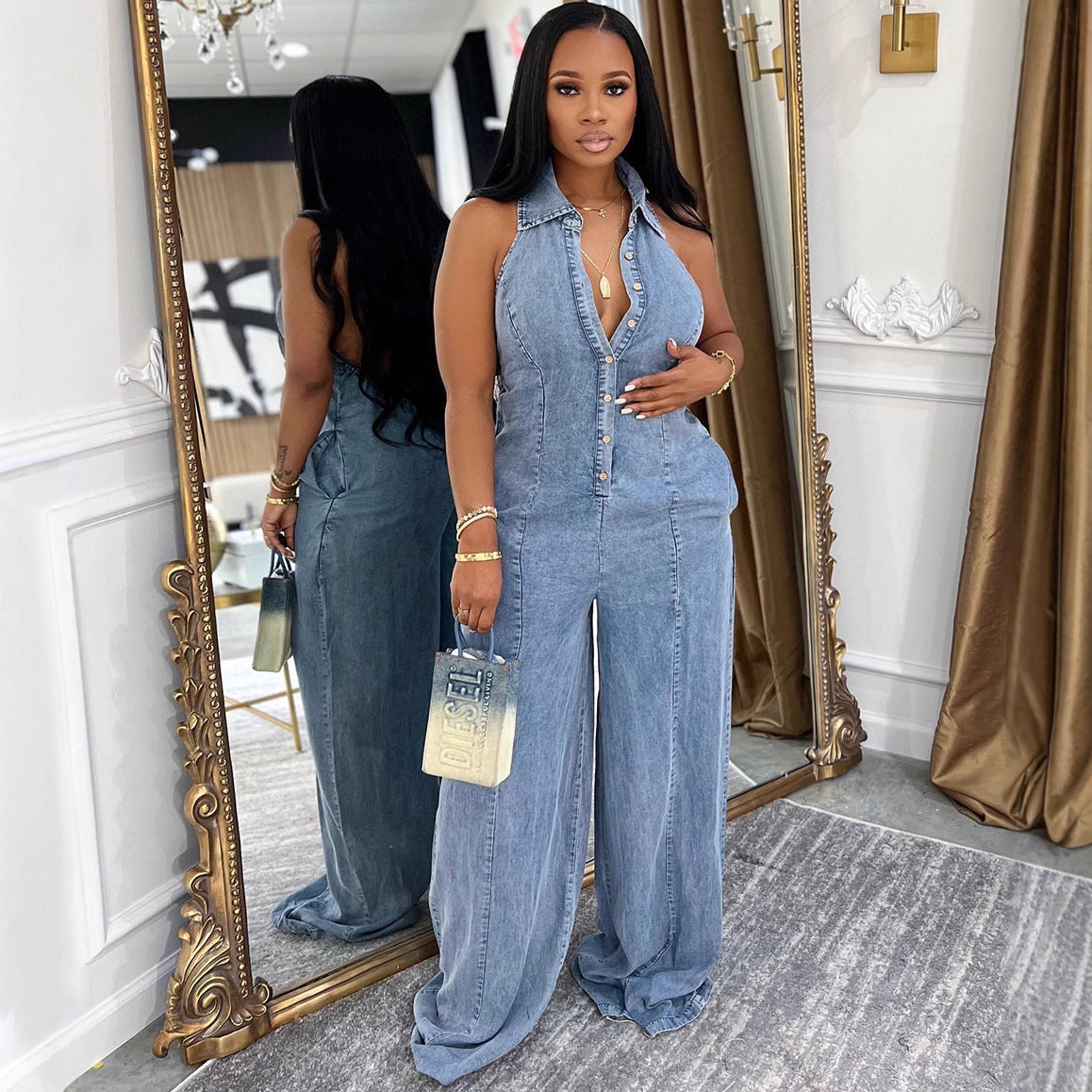 Women's denim jumpsuit by eprolo featuring a Western style with turn-down collar, halter neckline, and button closure.
