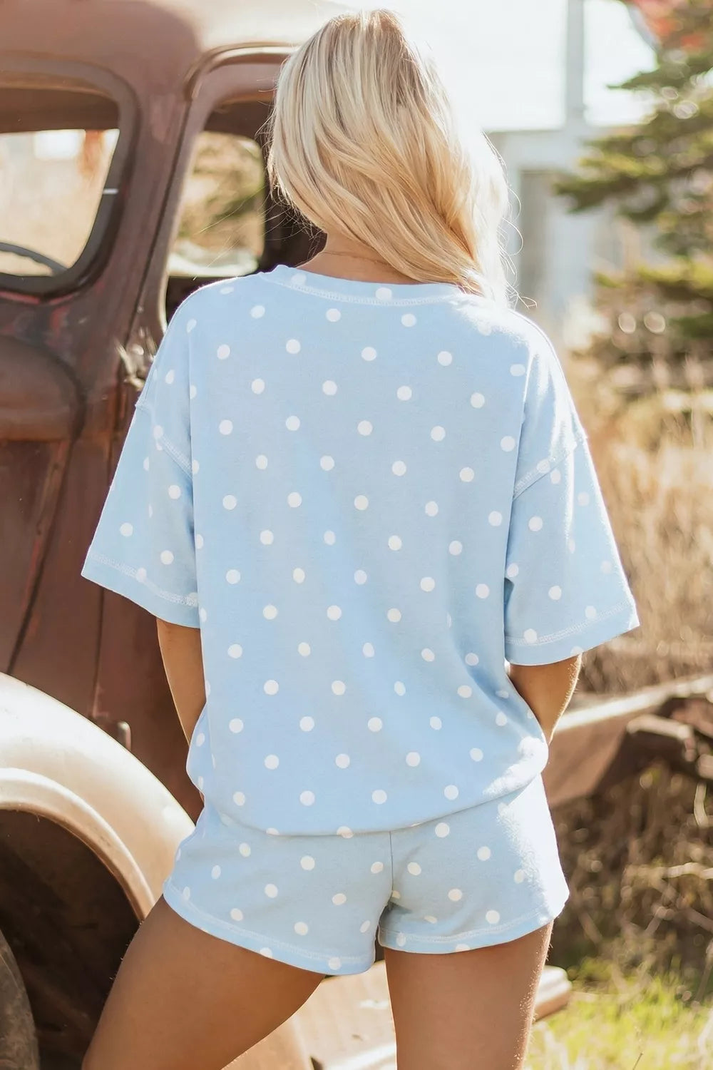 Polka dot round neck top and shorts set by Plush Fashion Hub, featuring a playful polka dot pattern and comfortable fit.