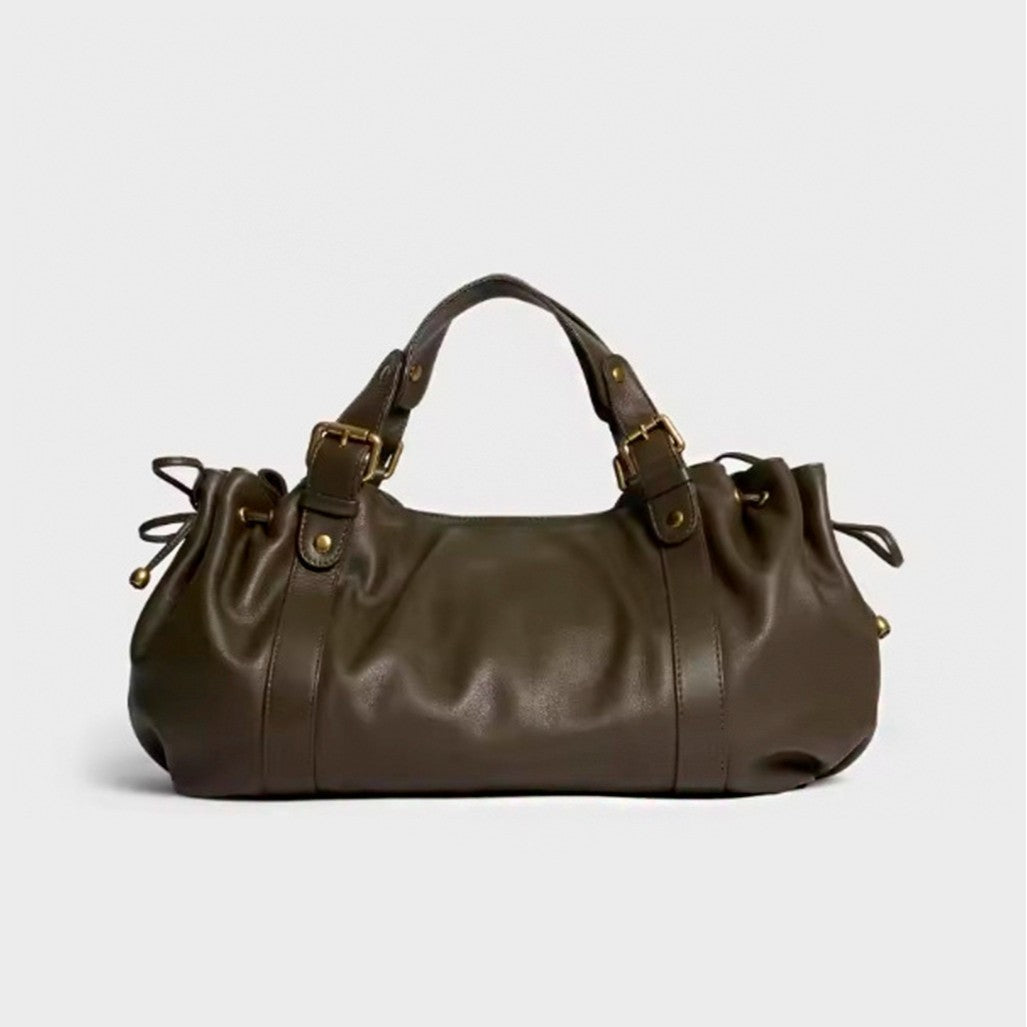 Dark brown leather slouchy satchel handbag with dual top handles, brass buckles, and drawstring sides.