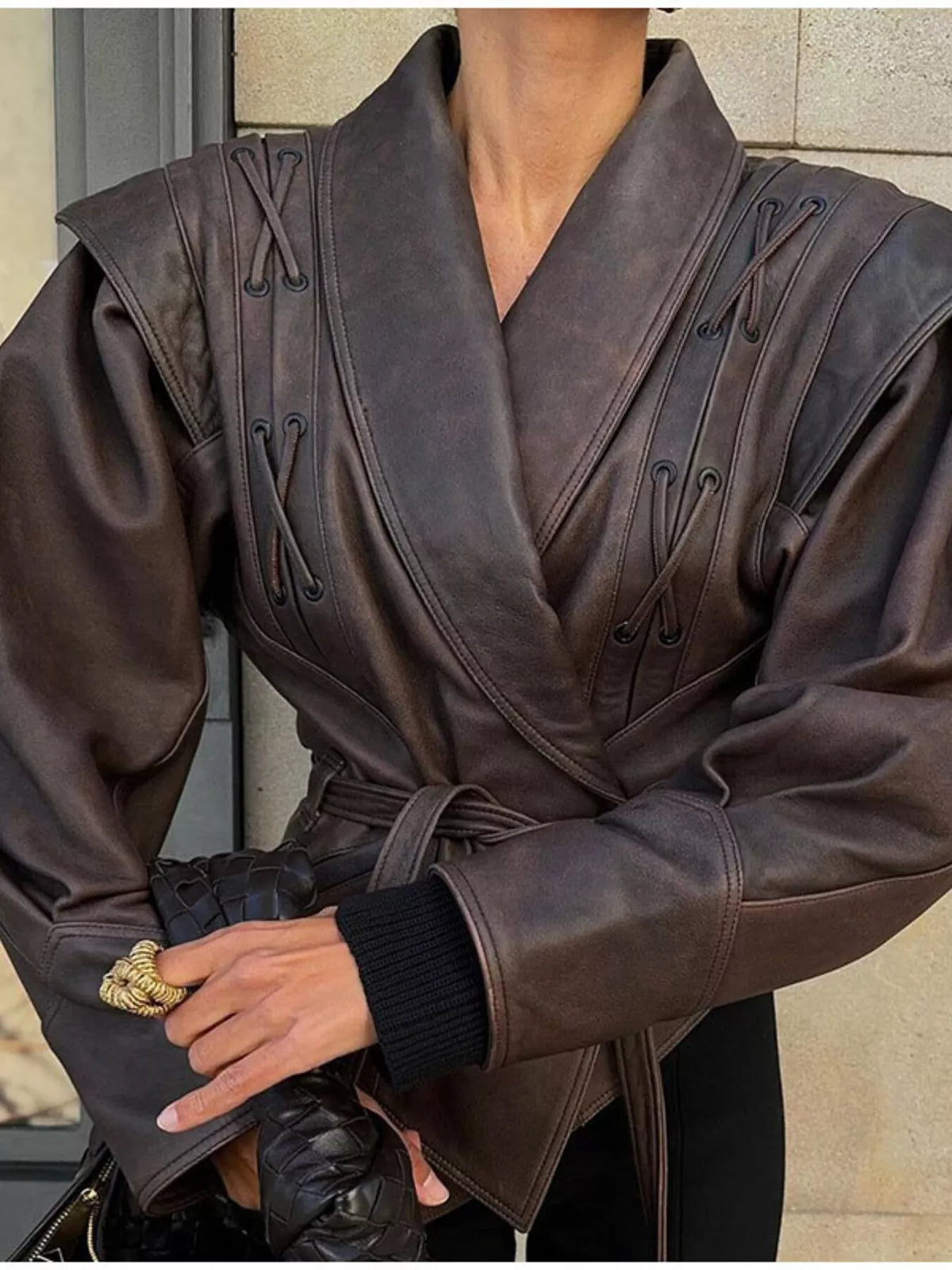 Women's leather belted jacket with shawl collar by Trendsi, featuring a stylish design and sleek silhouette.
