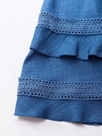 Shopimist lace detail v-neck mini dress featuring elegant lace accents and a fitted silhouette on a model.