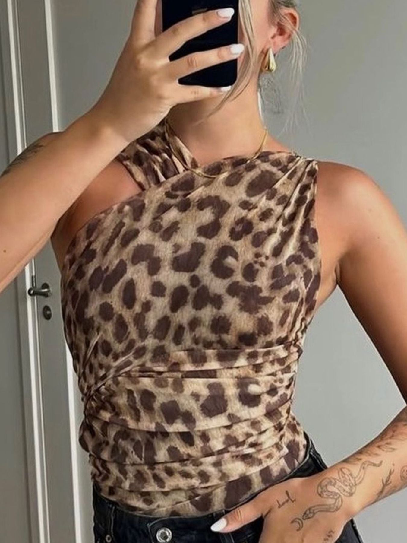 Leopard print asymmetrical ruched bodysuit featuring stylish animal print and one-piece design, perfect as a trendy top.