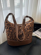 Adjustable strap tote bag from Shopimist featuring durable material and spacious main compartment with top handles.
