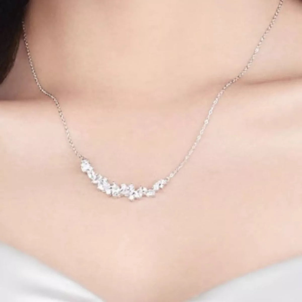 Sterling silver zircon necklace with a delicate chain and sparkling pendant, showcasing elegant jewelry craftsmanship.