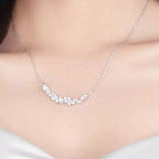 Sterling silver zircon necklace with a delicate chain and sparkling pendant, showcasing elegant jewelry craftsmanship.