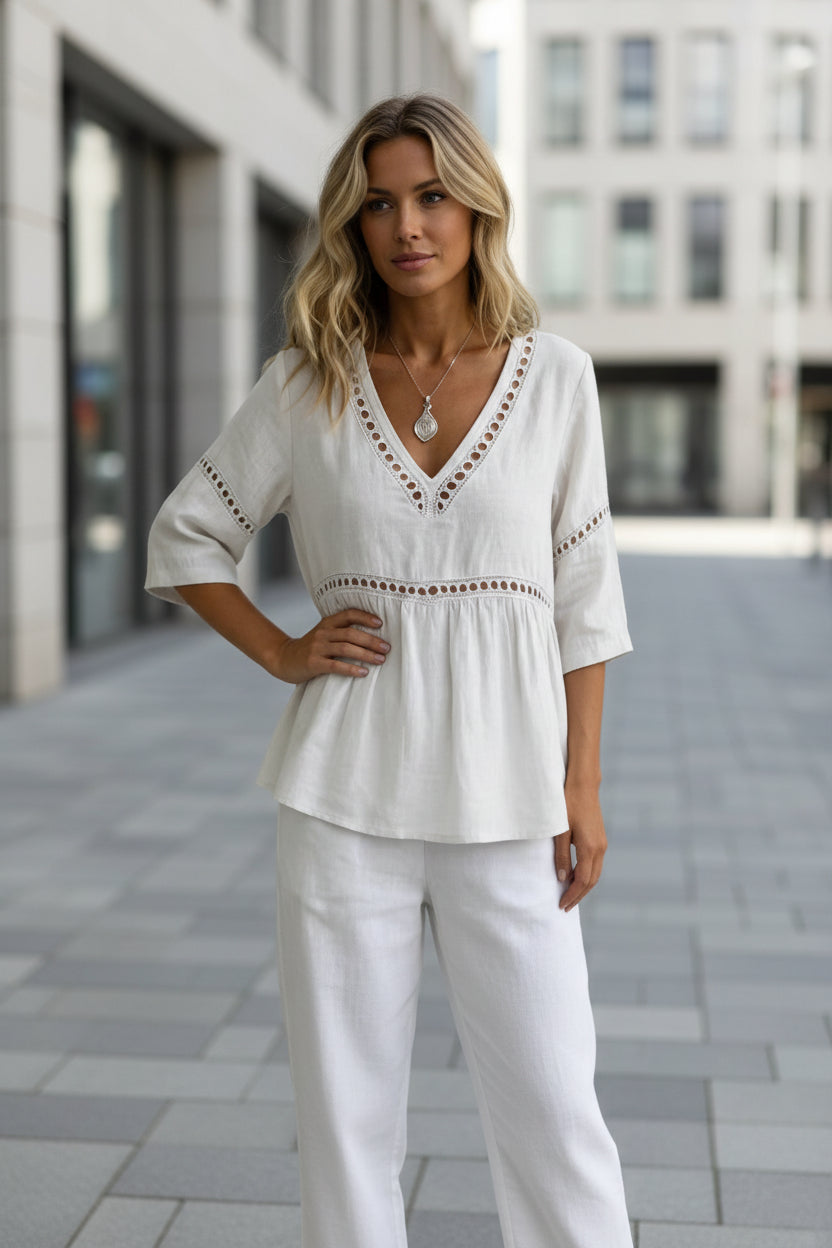Women's V-neck cotton-linen top with hollow-out fringe details, casualwear by FitiqueFit, shown on a model.
