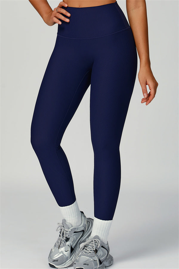 Fitglutes Activewear sports bra, jacket, and leggings 3-piece set for workout and gym, shown on a model in a fitness pose.