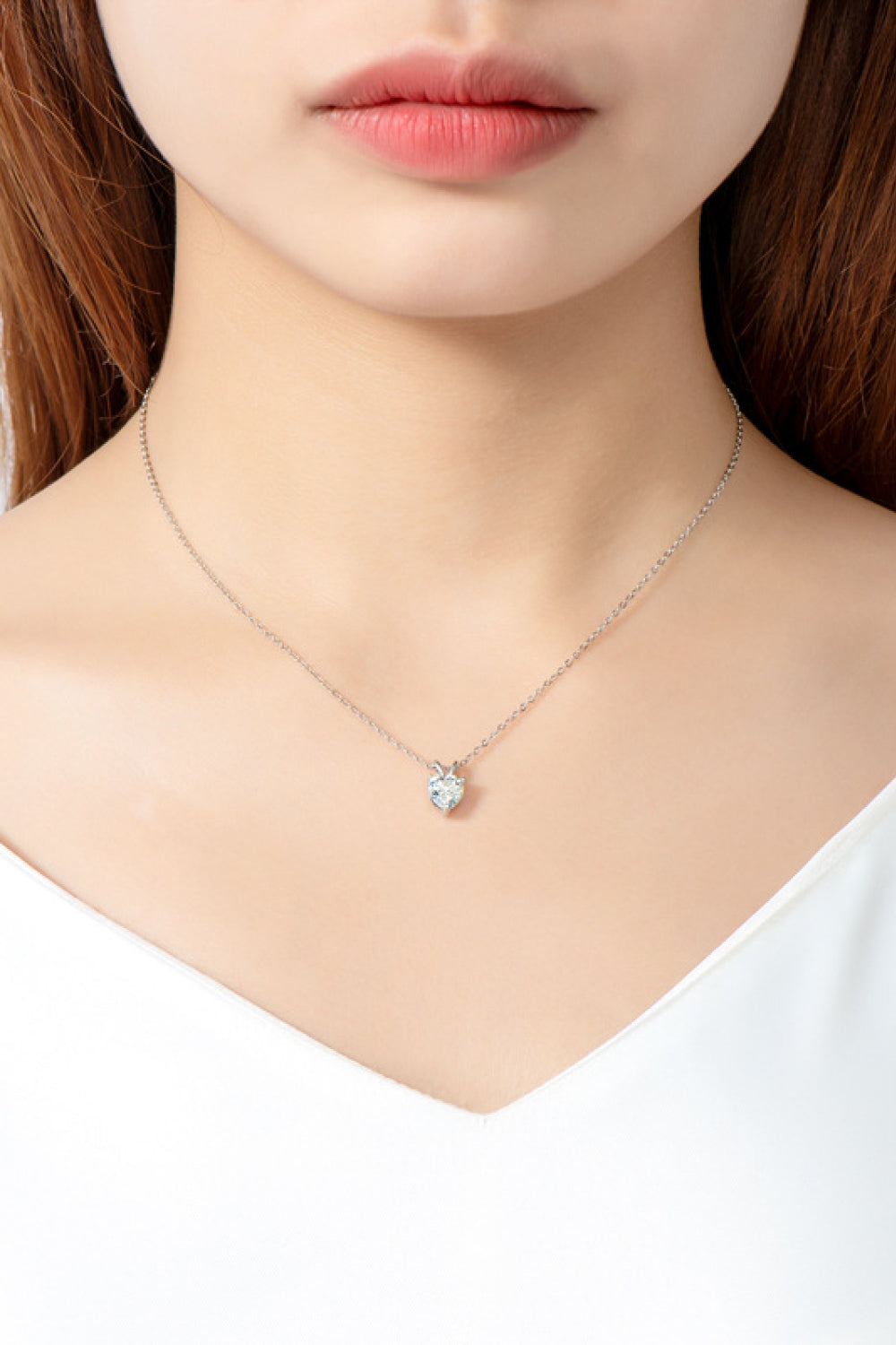 Heart-shaped 1 carat moissanite pendant necklace featuring a sparkling gemstone on a delicate chain.