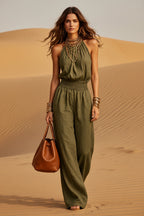 Women's sleeveless backless lace-up halter wide-leg jumpsuit by Plush Fashion Hub, featuring lace details and flowing wide-leg style.