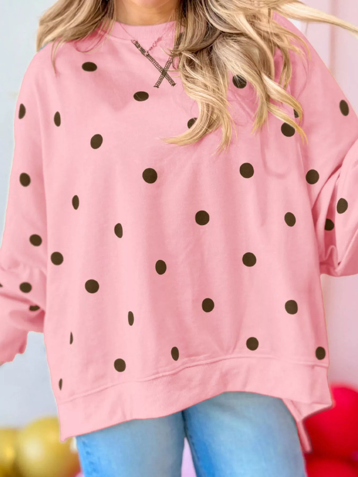 Polka dot oversized sweatshirt with side slit by Trendsi, featuring a relaxed fit and stylish design, shown in the product image.