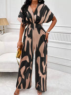Abstract print wide-leg jumpsuit by Trendsi featuring a stylish, flowing design with bold patterns and a comfortable fit.