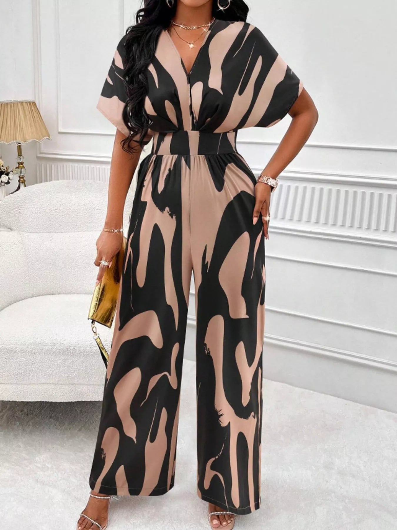 Abstract print wide-leg jumpsuit by Trendsi featuring a stylish, flowing design with bold patterns and a comfortable fit.