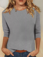 Solid color round neck T-shirt from Trendsi, featuring a classic fit and smooth fabric in a vibrant hue.