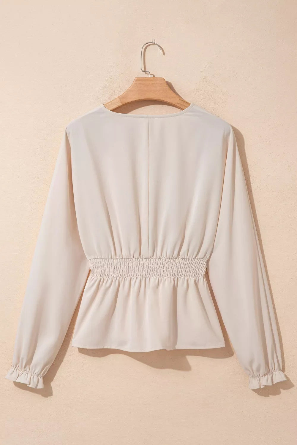 V-neck long sleeve smocked waist elegant blouse from Plush Fashion Hub, featuring a fitted design and stylish details.