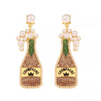 Champagne bottle earrings with pearls from Shopimist, featuring gold-tone metal and elegant design for stylish accessories.
