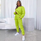Women's solid color round neck pullover sweatshirt and matching pants set by Plush Fashion Hub, casualwear outfit for comfort.