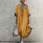 Women's printed batwing sleeve midi dress by Plush Fashion Hub featuring a loose fit linen blend fabric and stylish design.