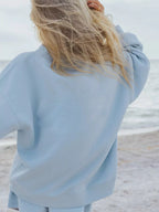 Plush Fashion Hub relaxed fit round neck sweatshirt and shorts set, casual 2-piece loungewear ensemble in soft fabric.