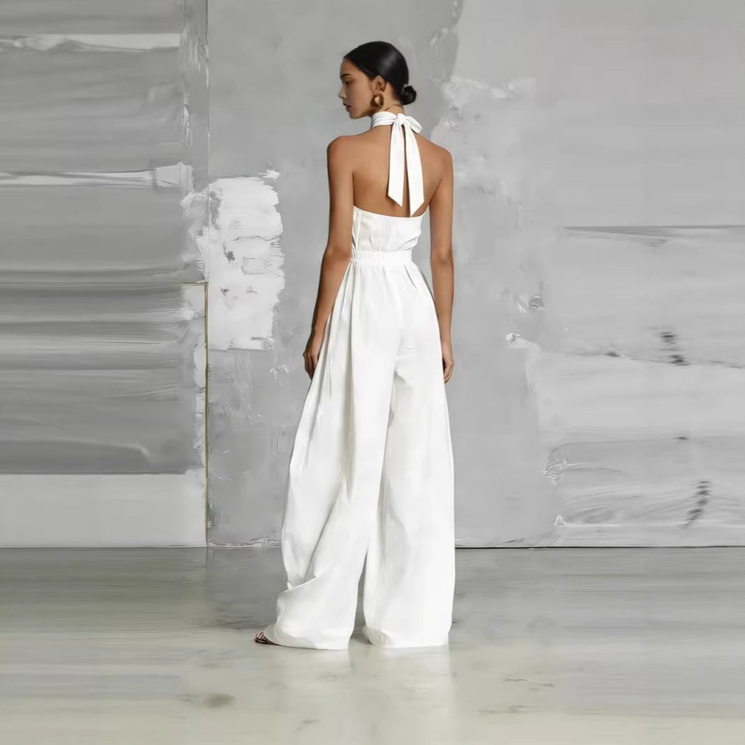 Women's beige belted pleated high-waist sleeveless jumpsuit from Plush Fashion Hub, casualwear with cinched waist and relaxed fit.