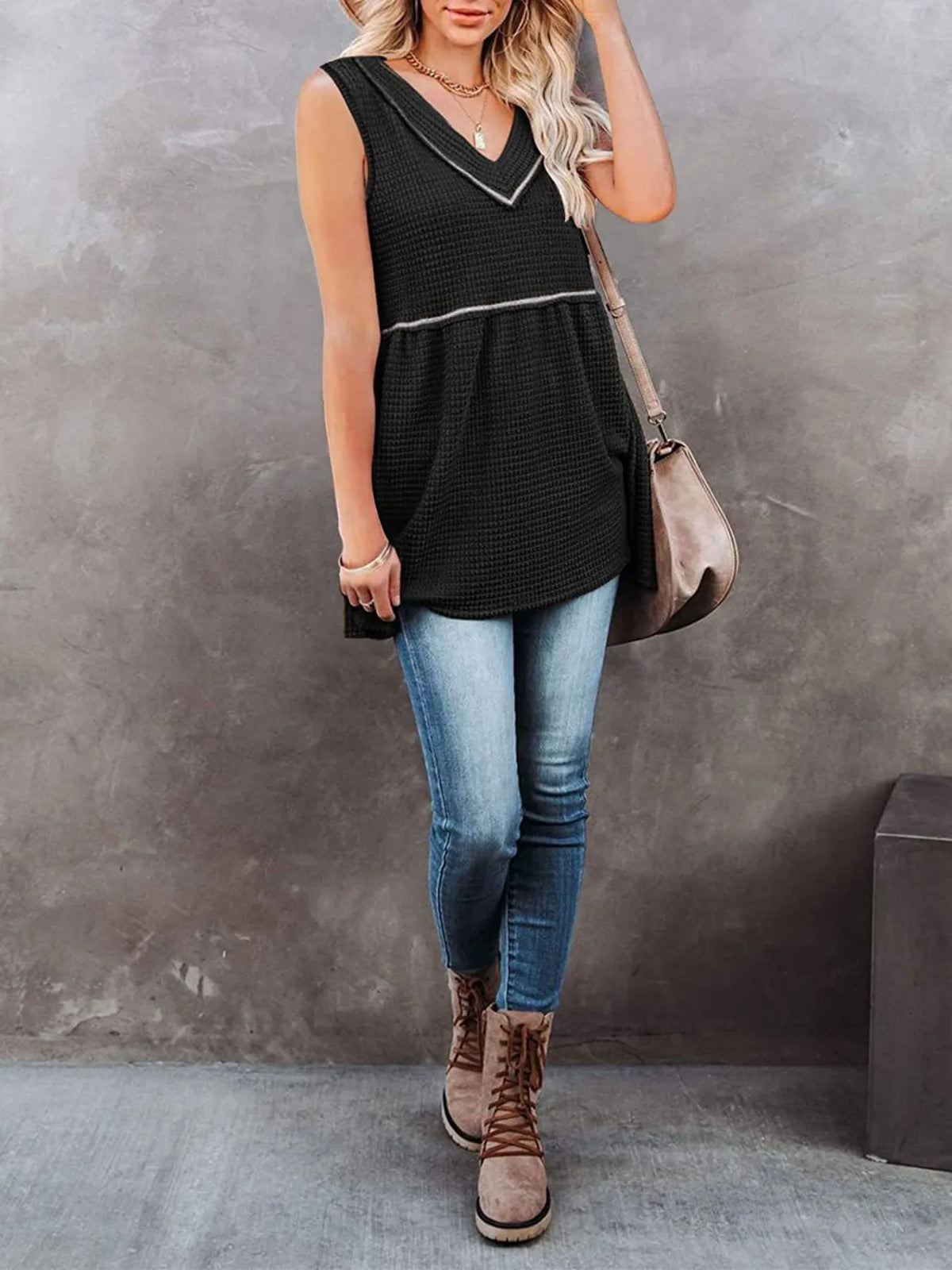 V-neck waffle knit tank top with contrast stitching from Plush Fashion Hub, shown in a close-up view of the textured fabric and stitching details.