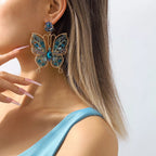 Butterfly rhinestone dangle earrings by Shopimist featuring sparkling rhinestones and delicate butterfly design.