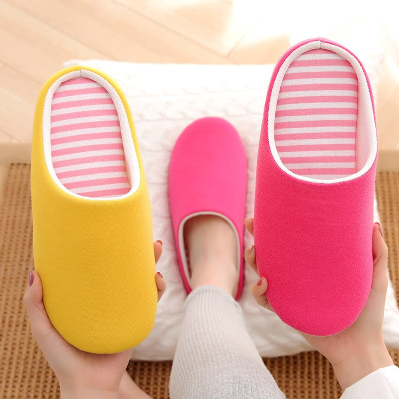 Soft cotton indoor slippers: yellow and vibrant pink slip-ons with white trim and pink-and-white striped insoles.